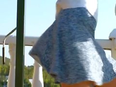 Petite teen toying hole on the balcony