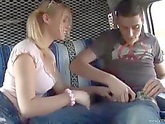 Pigtailed girl giving handjob in car