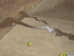 Asian slut pees outside