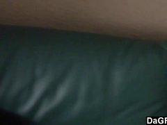 Busty latina gives a handjob on a couch