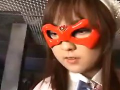 Young Asian heroine in an orange mask is taken down in a fi