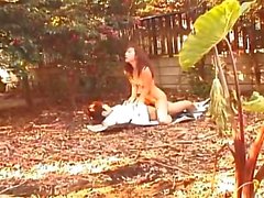 Asian babe is fucked in the garden on some pa