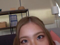 Busty blond Asian in very close up POV