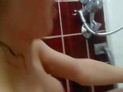 Sweet babe shaving herself in bathtub