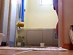 Asian teen pissing cup